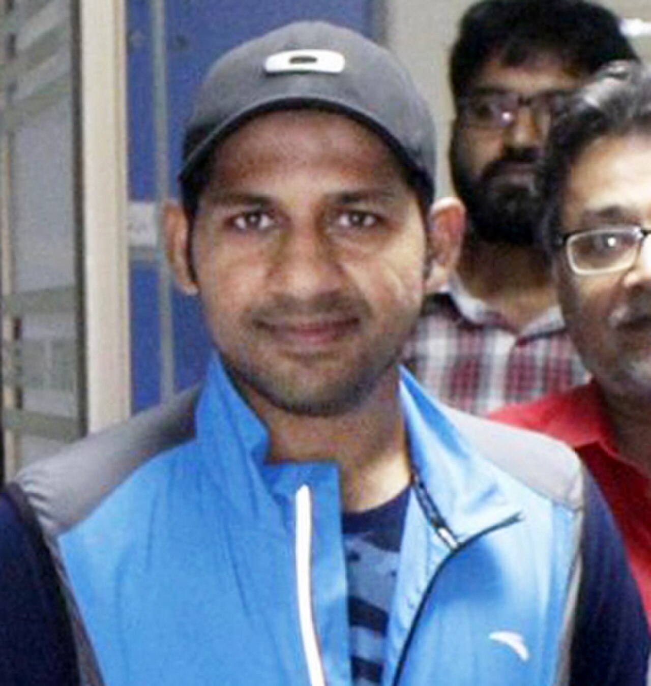Pakistan wicketkeeper-batsman Sarfraz Ahmed in Pakistan cricket kit, photographed with fans at a Daily Dunya office event in Karachi in 2016.