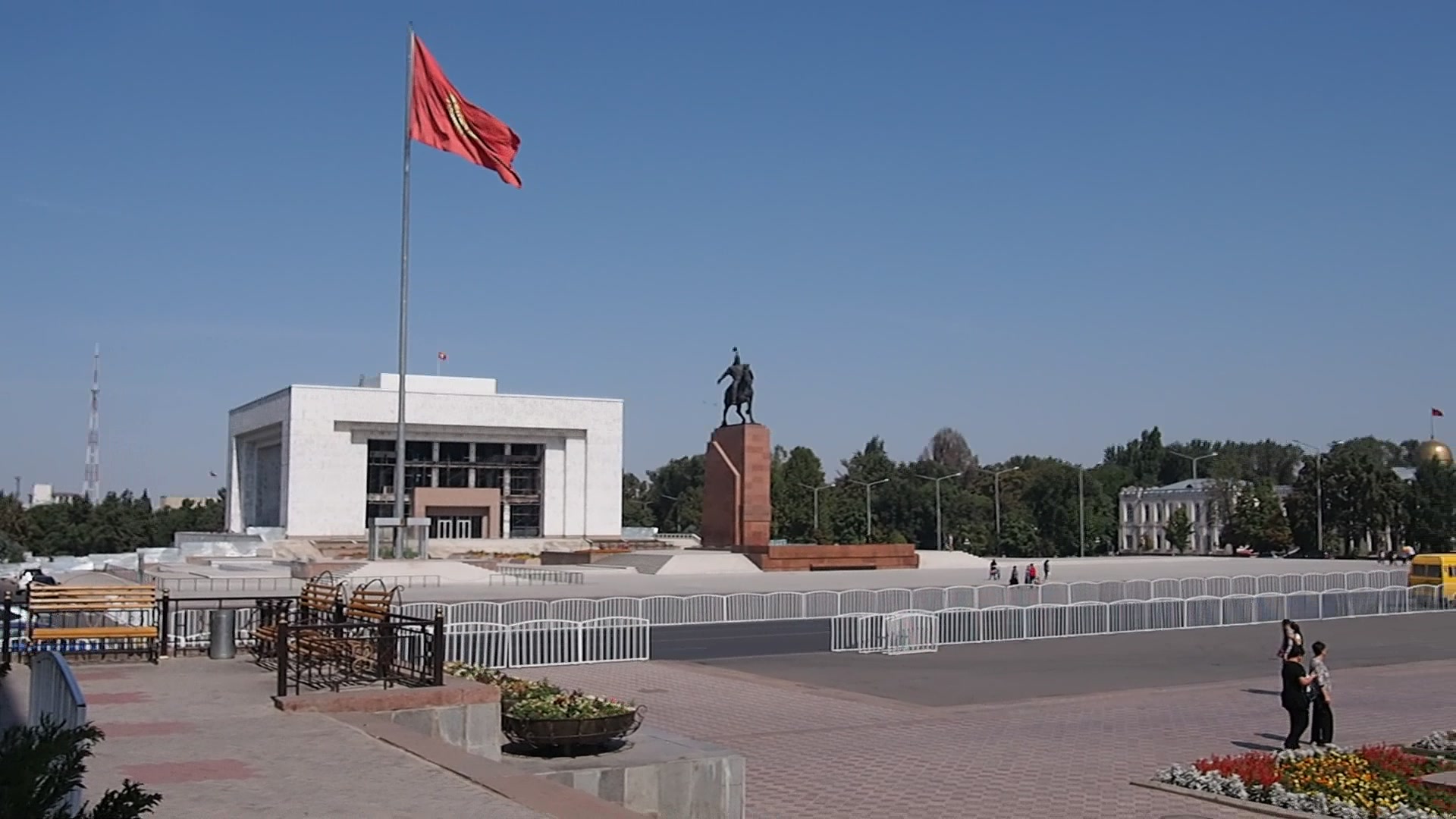 Ala-Too Square in central Bishkek with the State Historical Museum and national flagpole under clear skies