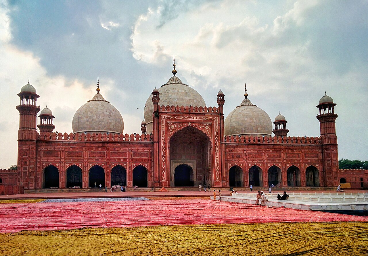 People gather in the courtyard of the Badshahi Mosque in Lahore ahead of Eidul Azha.