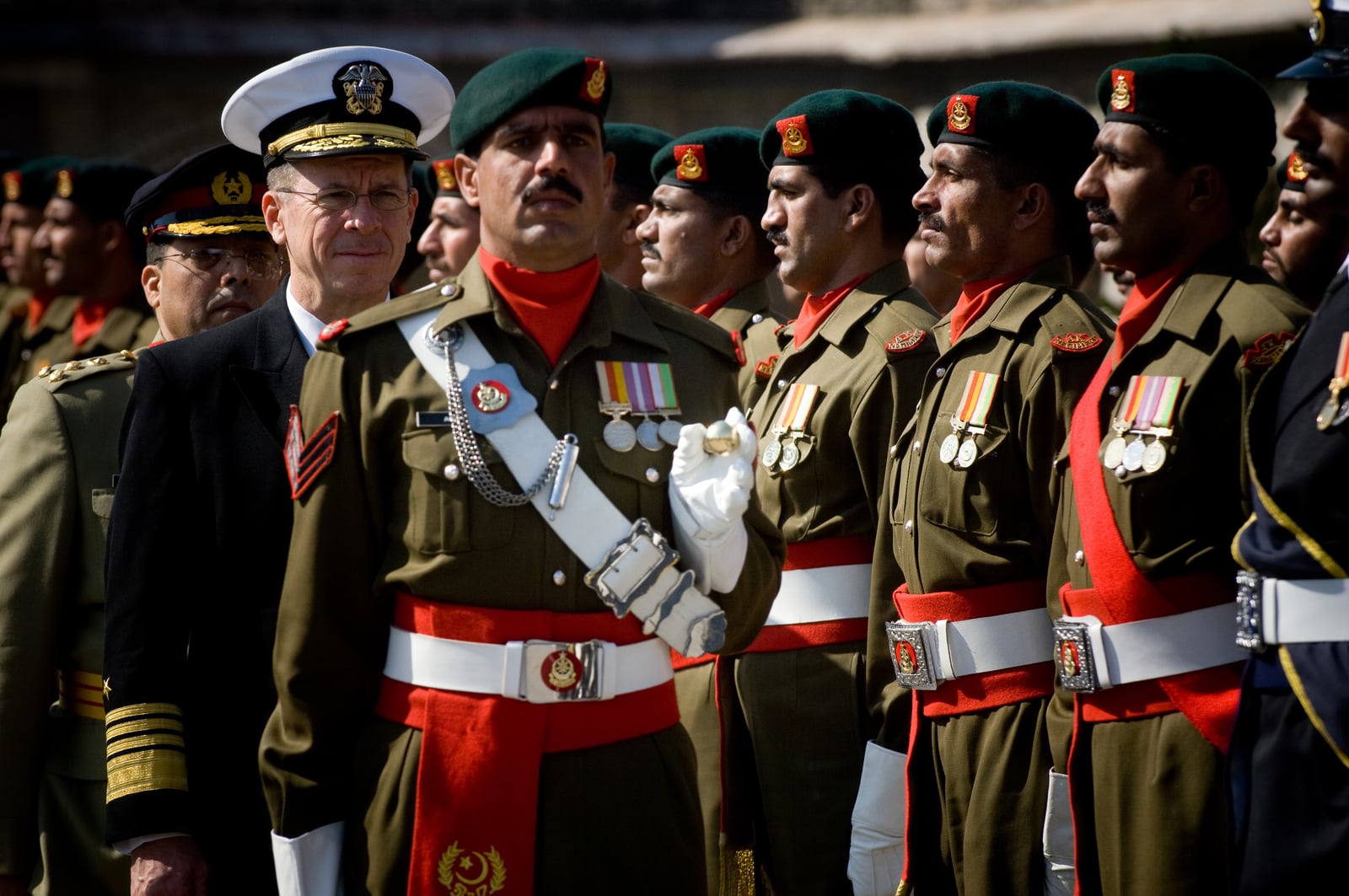 Pakistani soldiers standing in formation during a military review.
