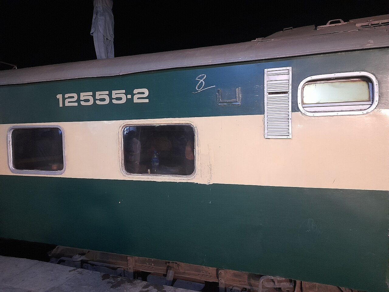 A Tezgam Express passenger coach photographed on the railway
