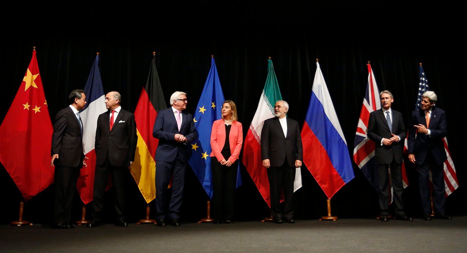 Diplomats and officials seated around a table at the 2015 Iran nuclear talks in Vienna.