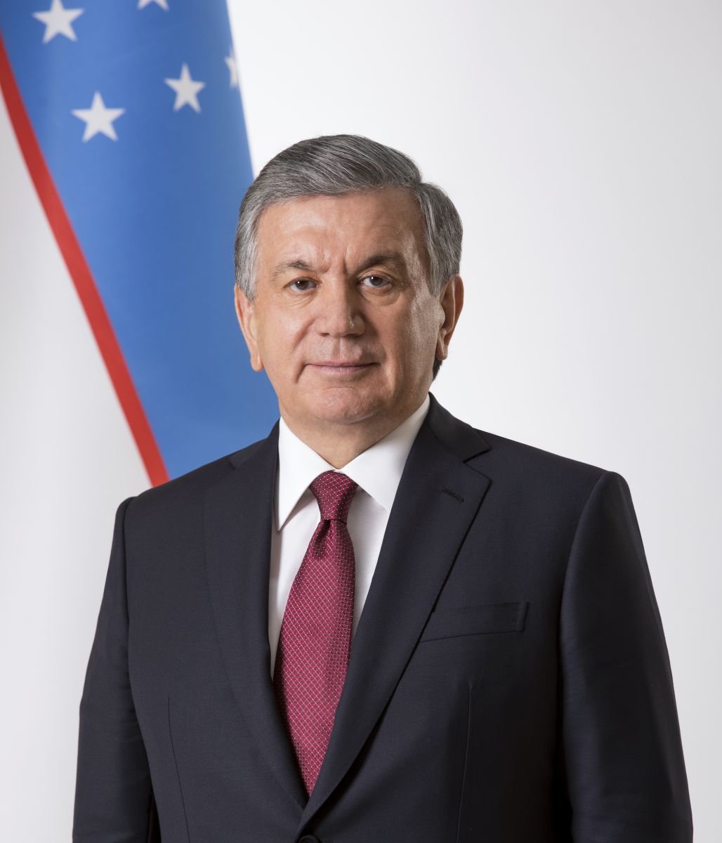 Official portrait of Uzbekistan President Shavkat Mirziyoyev wearing a dark suit and tie