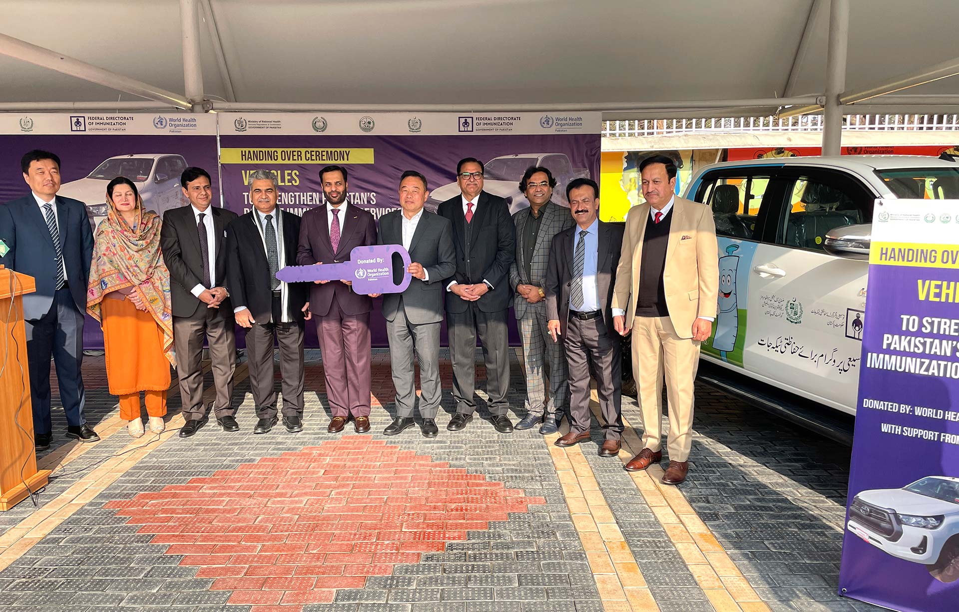 WHO Representative in Pakistan Dr Luo Dapeng and Federal Health Minister Syed Mustafa Kamal hand over vehicles to provincial authorities in Islamabad on 14 January 2026.